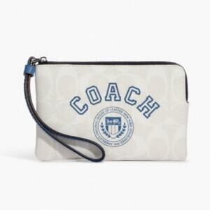 COACH VARSITY CORNER ZIP WRISTLET IN SIGNATURE CANVAS CHALK/INDIGO